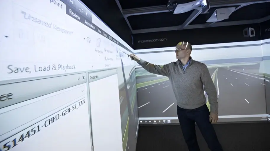 A man using the touchscreen feature in a Cube system