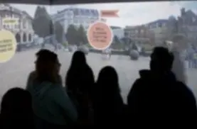 Students watching a 360 tour during uni open day
