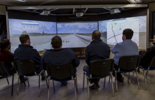 People on a meeting discussing a project on a Cine system
