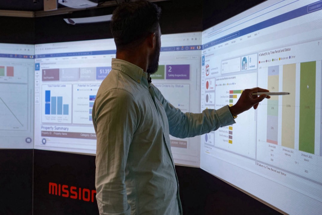 A man using a software application on a Mission Room 